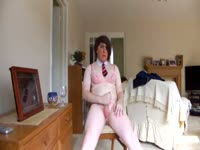 Joyous transsexual rookie Lucy Fox removing her sexy suit for a solo cock pleasuring session